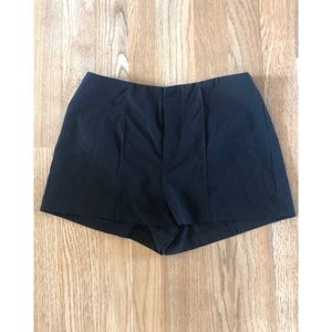 Black pleated shorts
